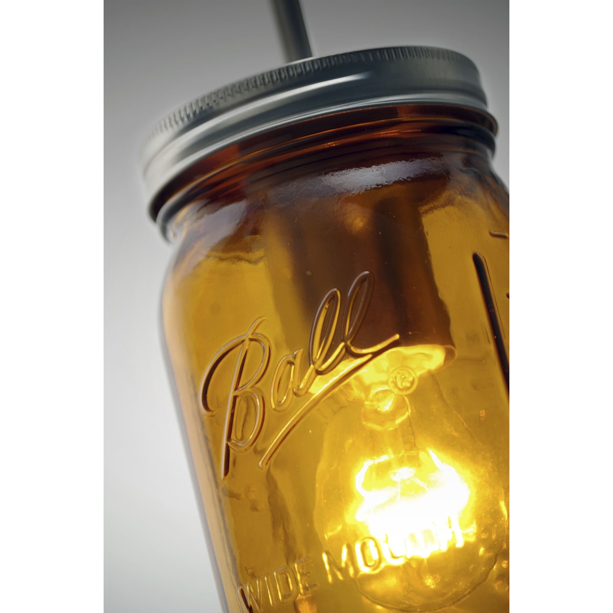 Milo 1 Light Bronze Pendant Ceiling Light in Transparent Amber Glass